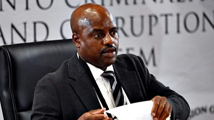 South African ex-police chief gets tissue stuck on forehead while sweating during corruption inquiry