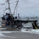 Massive fishing boat runs aground at popular beach with 1,000 gallons of diesel on board