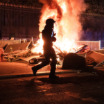 Photos show aftermath of riots as masked groups clash with police across France